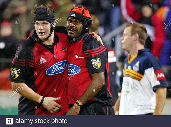 new-zealands-canterbury-crusaders-marika-vunibaka-r-is-congratulated-by-team-mate-richard-mccaw-after-scoring-the-first-try-in-the-super-12-final-against-australias-act-brumbies-at-jade-stadium-in