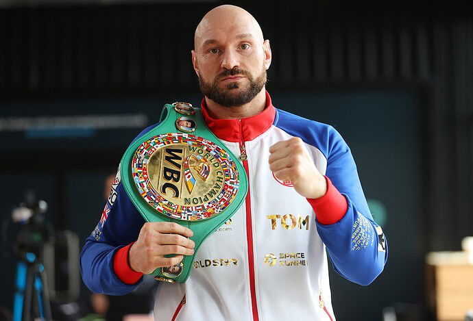 tyson-fury-poses-wbc-belt