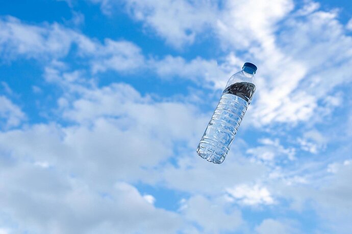 pastel-water-bottles-on-a-bright-sky-background-free-photo