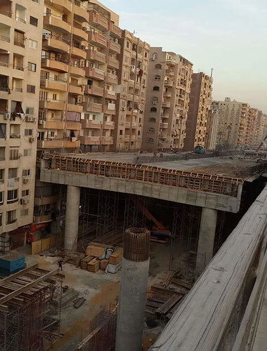 highway-bridge-centimeters-away-residential-area-cairo-egypt